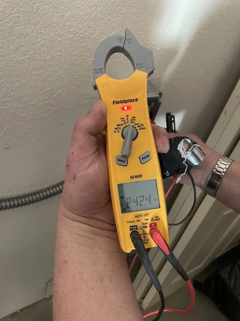 Voltage testing with clamp meter during Ceiling Fan Installation in New Haven